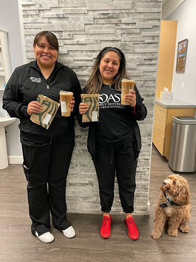 staff members standing inside Oasis Family Dentistry and Orthodontics