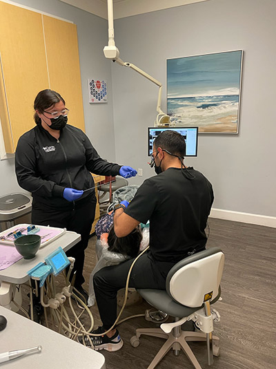 Dentist at Oasis Family Dentistry working on an emergency dentistry patient